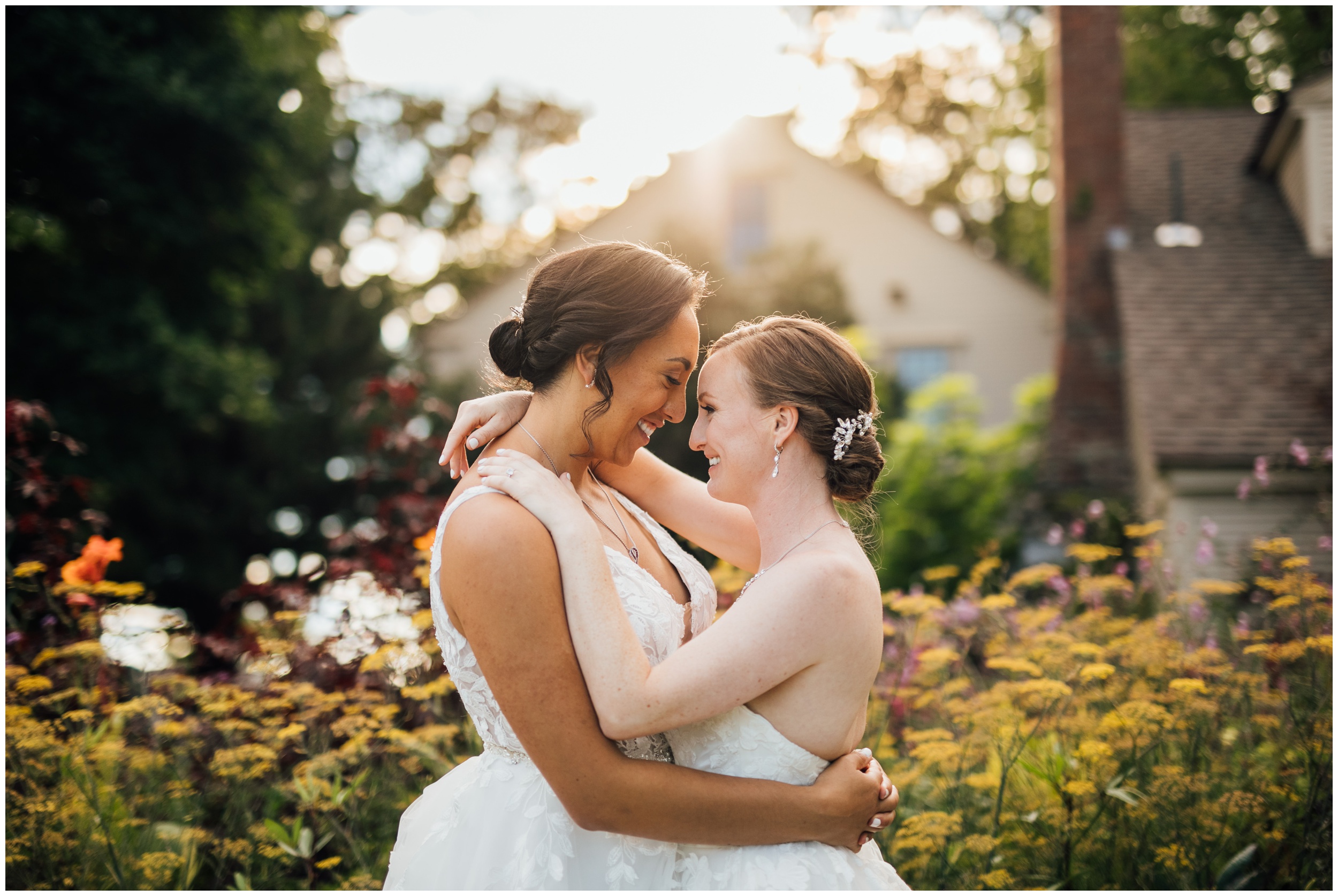 Two brides sharing an intimate portrait at New England Botanic Garden at Tower Hill during their same sex wedding