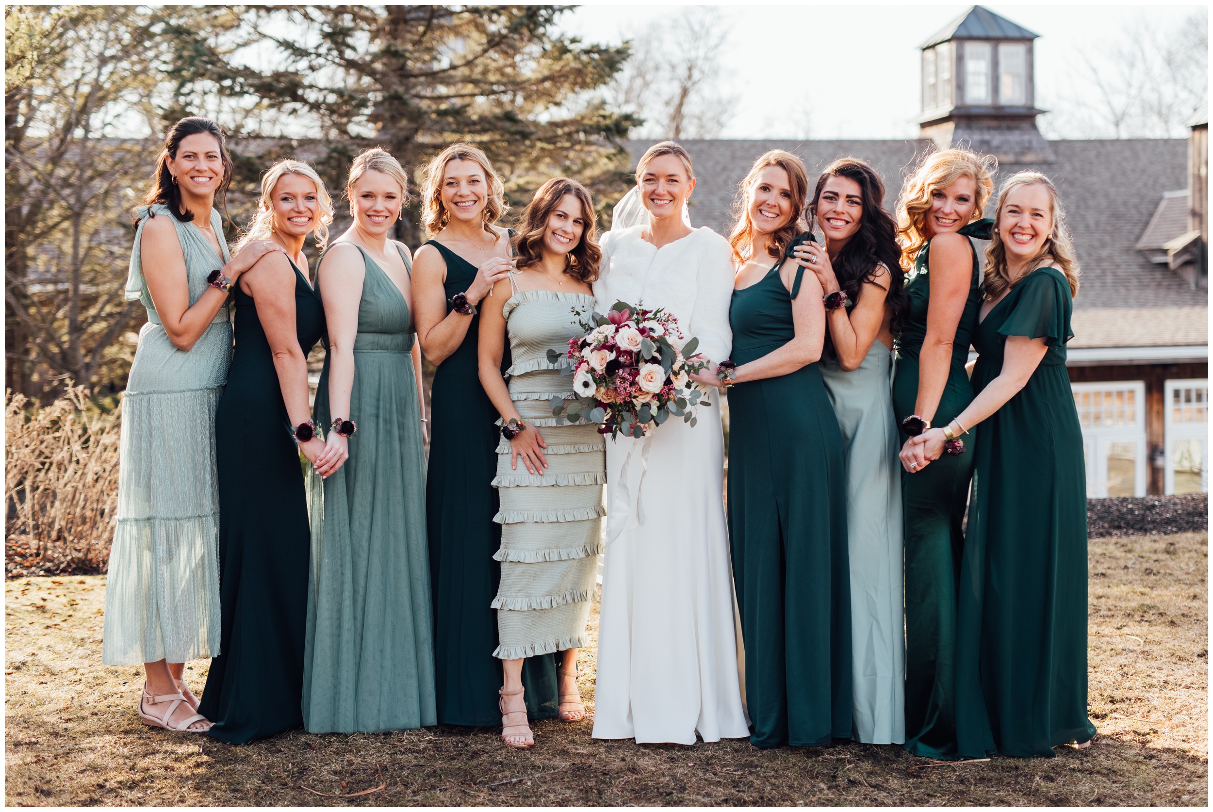 Bride with bridesmaids during winter wedding at Red Lion Inn in Cohasset MA