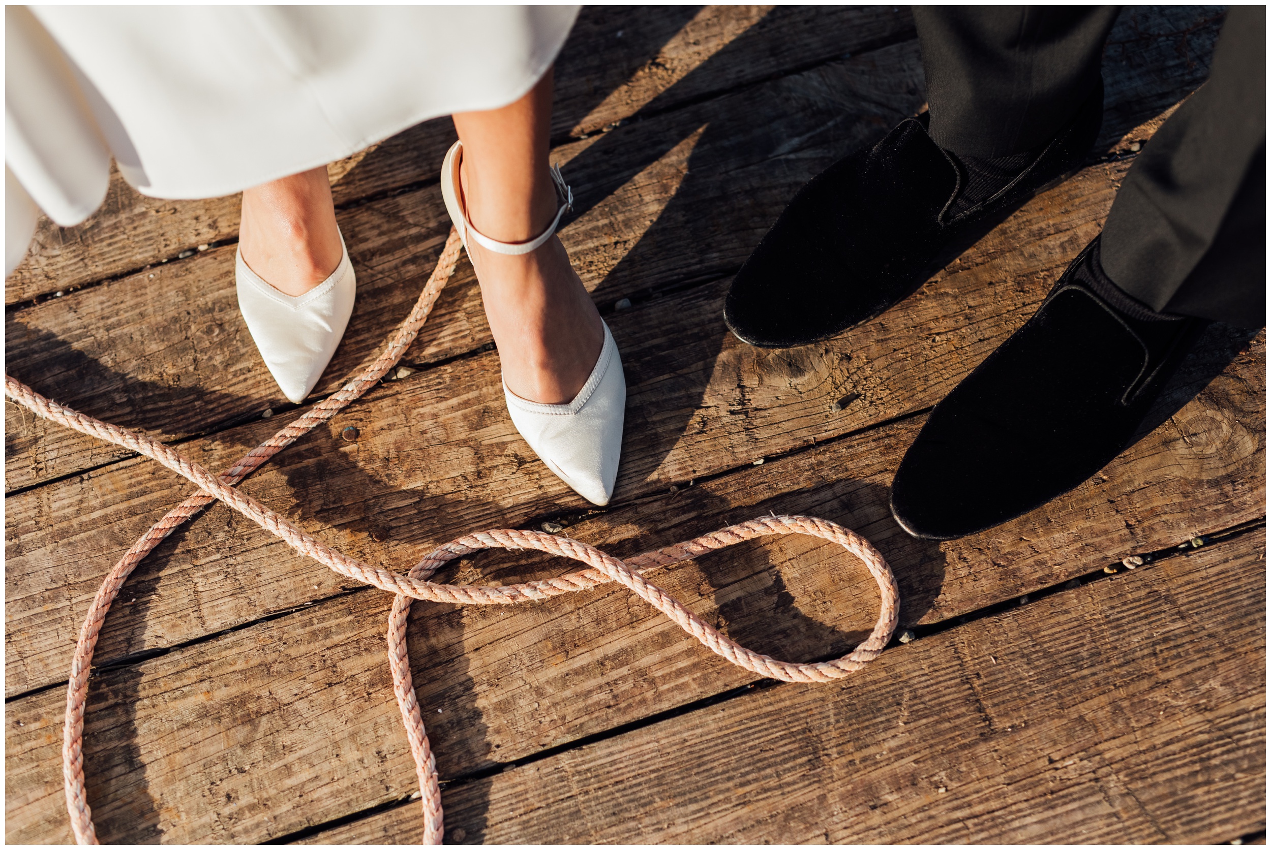bride and grooms shoes on a dock with a robe in Cohasset ma 